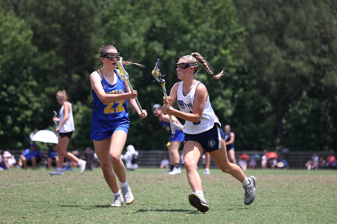 Players running at 2024 USA Lacrosse Women's National Tournament