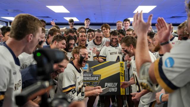 Chris Kavanagh leads Notre Dame's celebration after securing a Final Four berth.