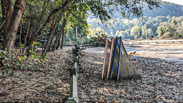 Lacrosse goals covered in mud and other elements laid bare by Hurricane Helene in Asheville, N.C.