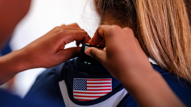 U.S. National Teams athlete getting STATSports Apex Athlete Series GPS tracker inserted into vest before competition