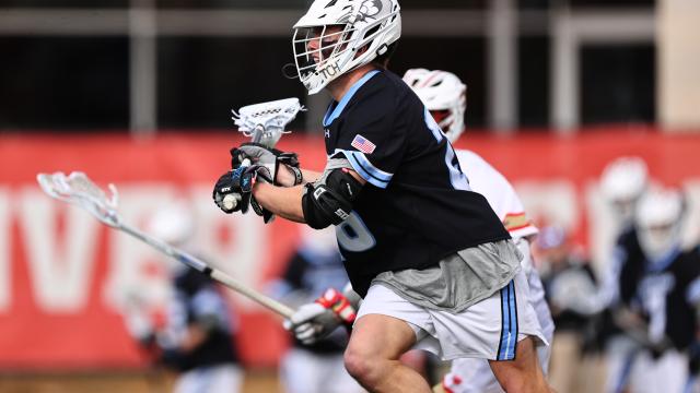 Hopkins defensive midfielder Pat Hackler after scooping one of his four ground balls at Denver