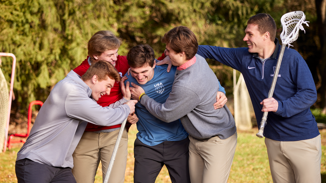 From left, CJ,  Caden, Cole, Colin and Connor Kirst rough house in the family's backyard in Bernardsville, New Jersey.