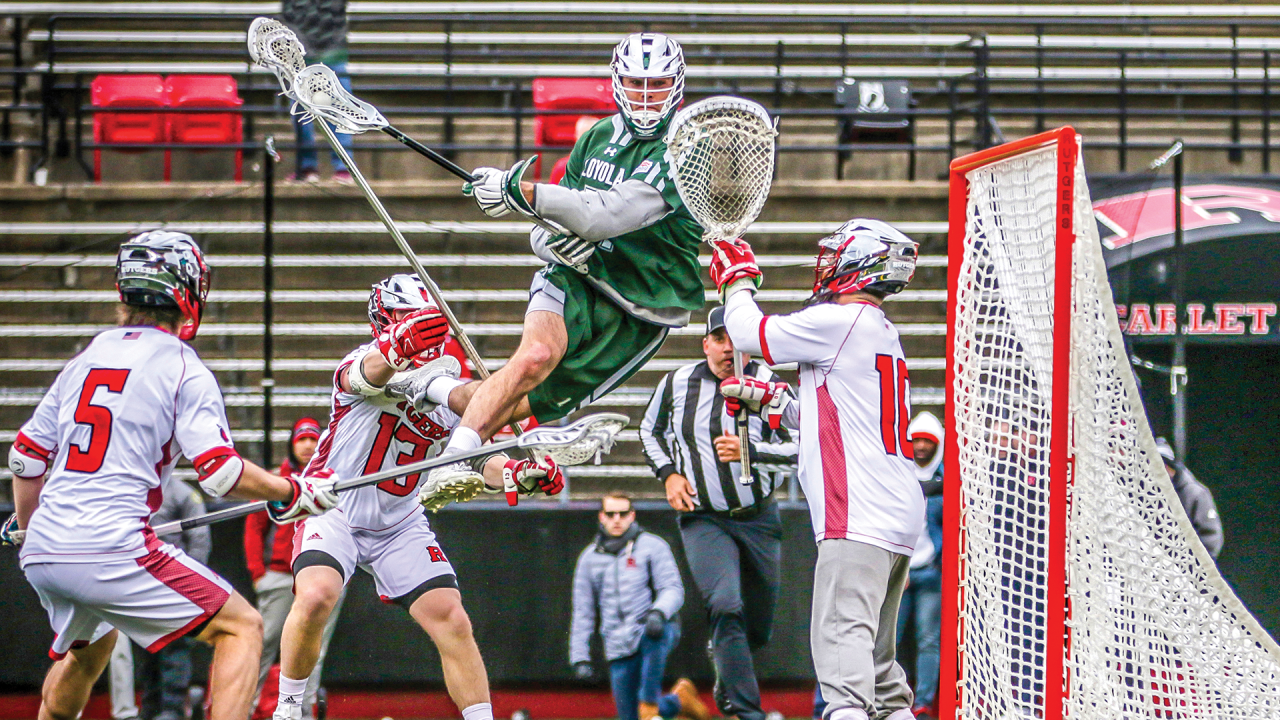 Loyola's Pat Spencer goes airborne in a 2019 game at Rutgers