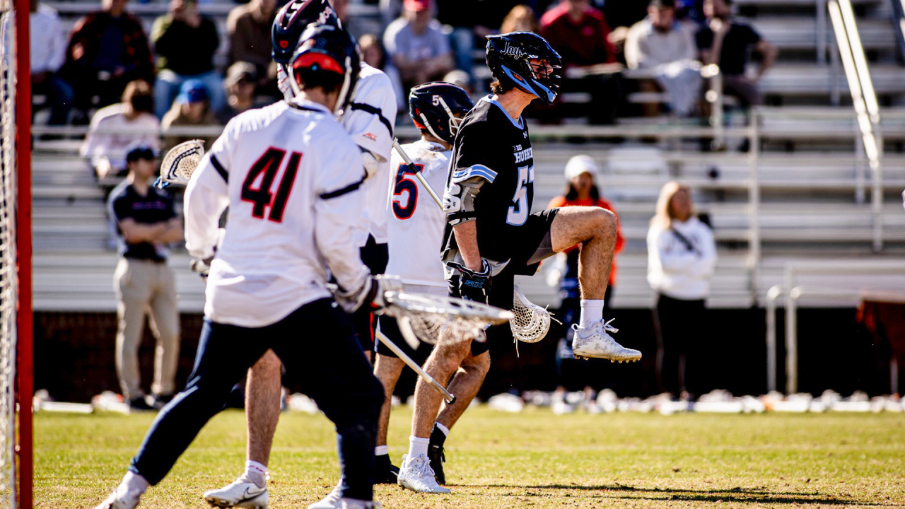 Johns Hopkins' Jonathan Peshko celebrates after scoring at Virginia