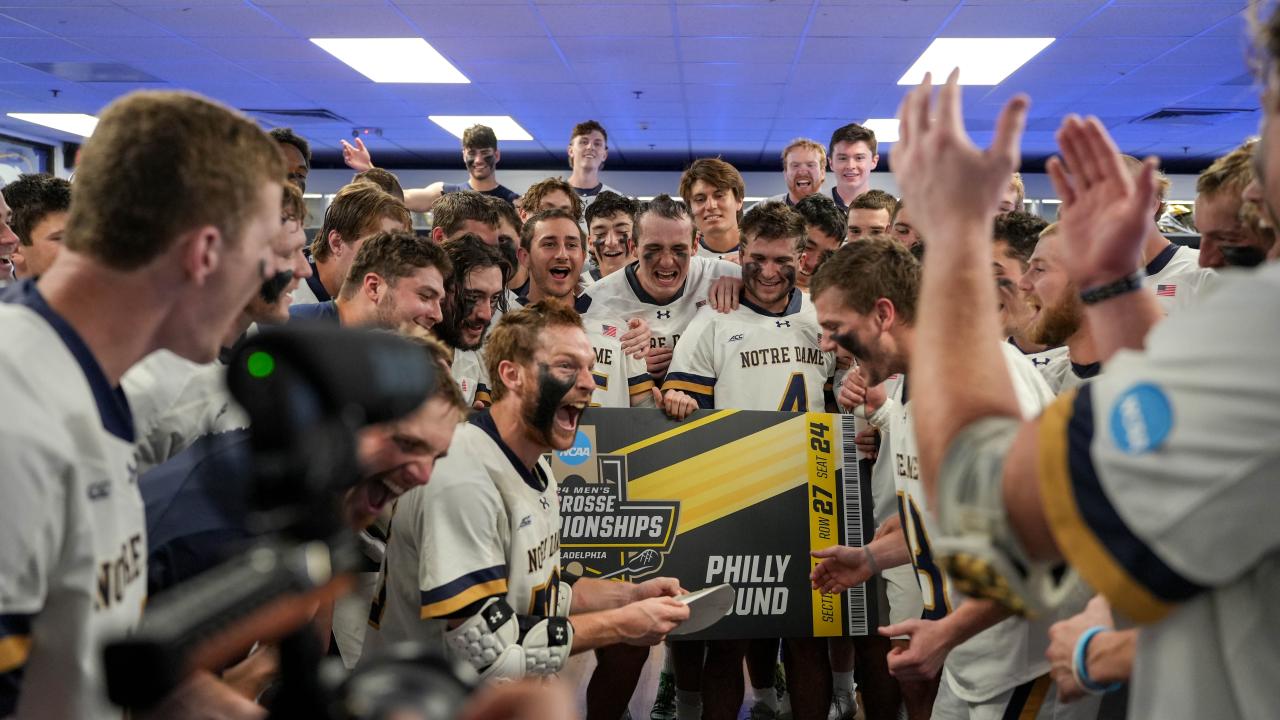 Chris Kavanagh leads Notre Dame's celebration after securing a Final Four berth.