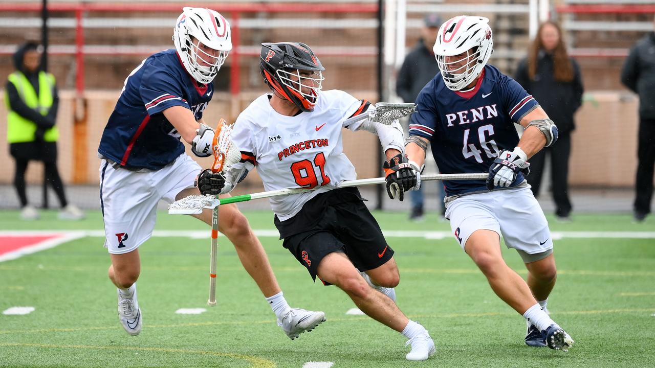 Princeton junior attackman Coulter Mackesy evades two Penn defenders.