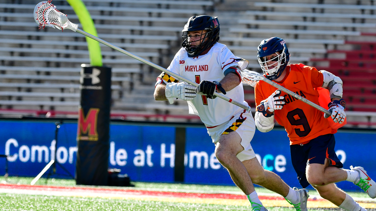 Maryland's Ajax Zappitello sprints up the field as Virginia's McCabe Millon gives chase.