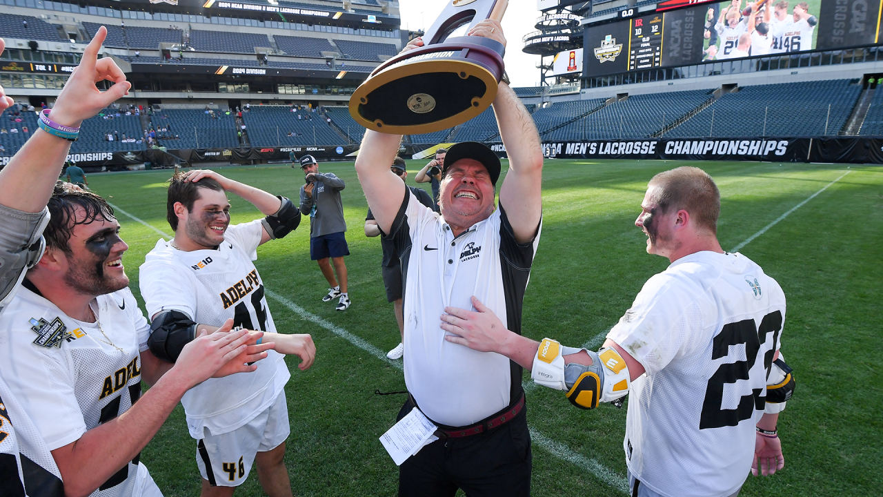 Gordon Purdie hoists the NCAA championship trophy.