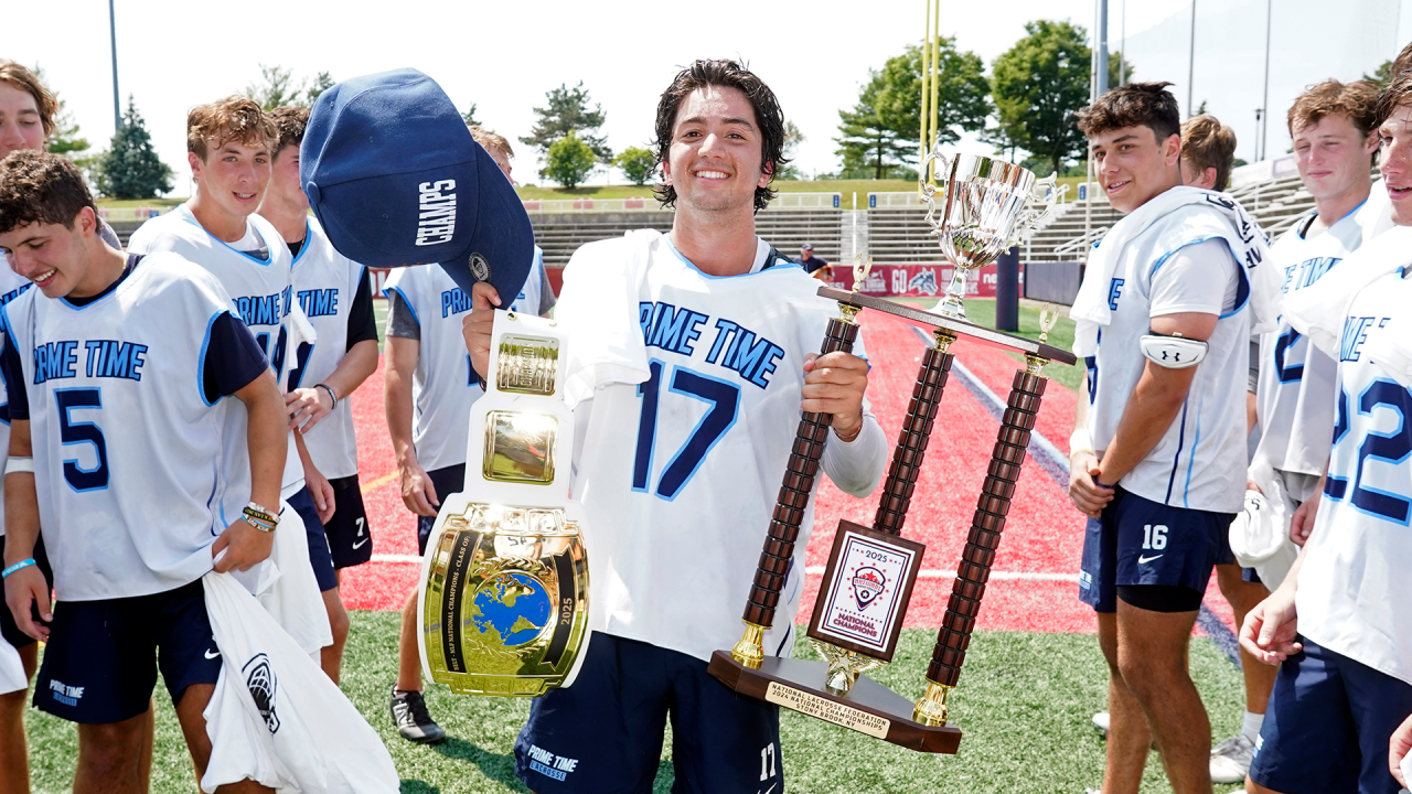 Prime Time 2025 goalie Ty Ramachandran with the MVP belt and the NLF National Championship trophy 