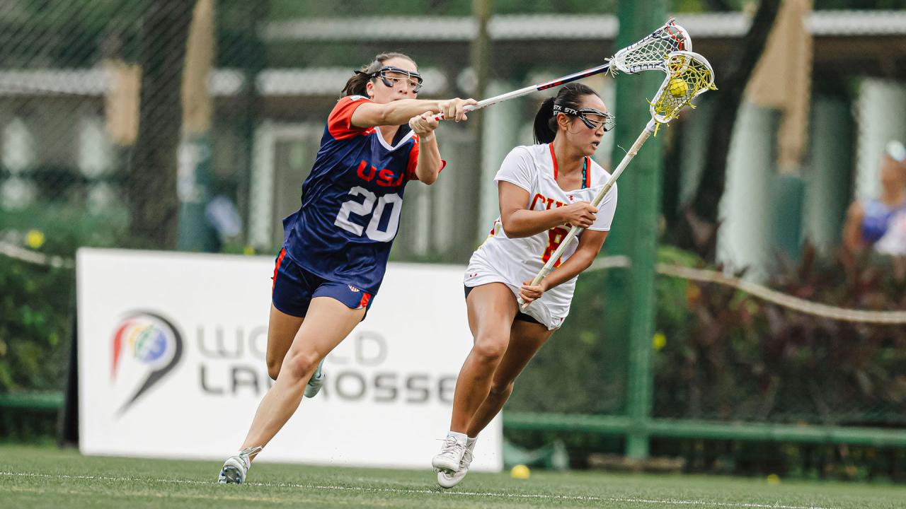 USA defender Grace Callahan applies pressure against China in U20 women's lacrosse world championship tournament.