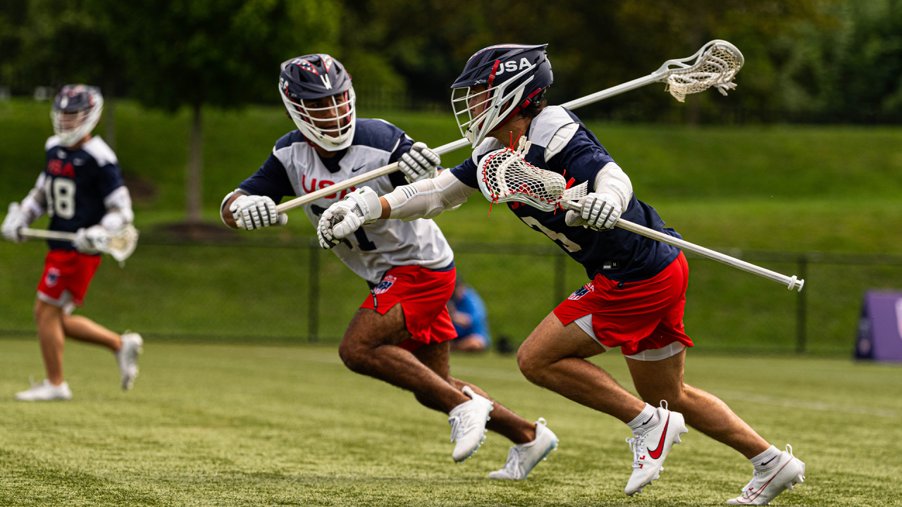 Michael Marshall defends Liam White during U20 training camp.