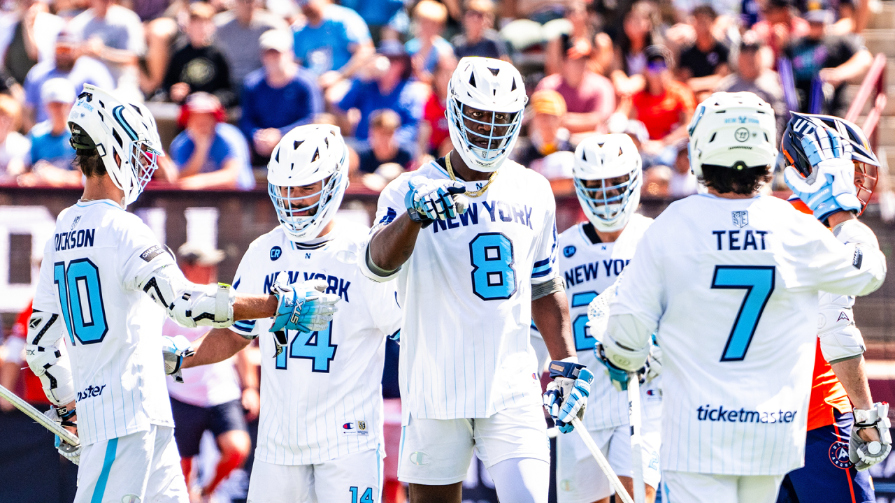 Xander Dickson (10), Myles Jones (8), Jeff Teat (7) and teammates come together to celebrate a goal in the New York Atlas win over Utah in Denver.