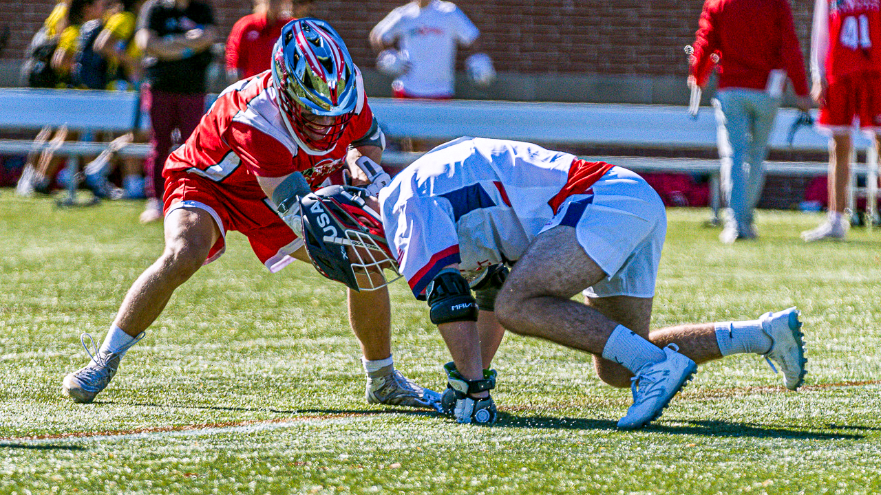 USA Select U18 athlete Caleb Caldwell wins the clamp on a faceoff against Team Ontario at the Brogden Cup