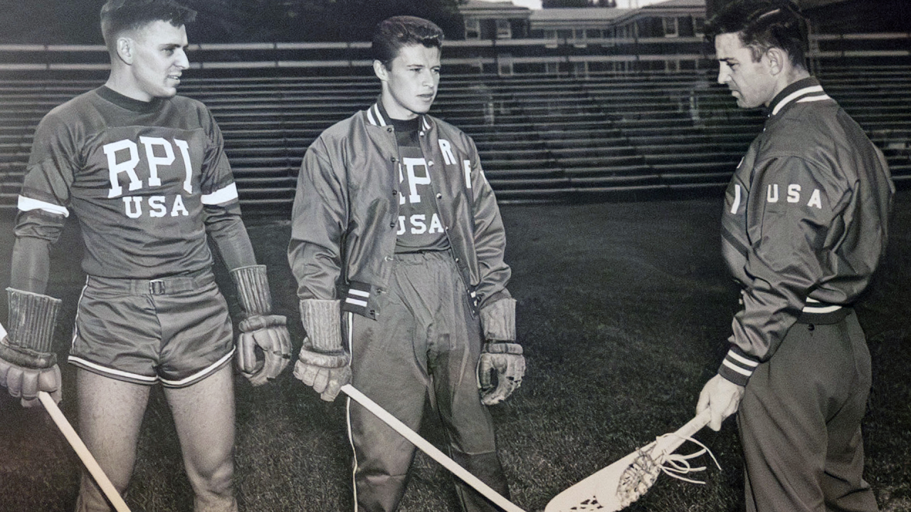 Bill Coleman (center) and an RPI lacrosse teammate (left) with Coach Ned Harkness (right) in England in 1948, representing the United States in the 1948 Olympics